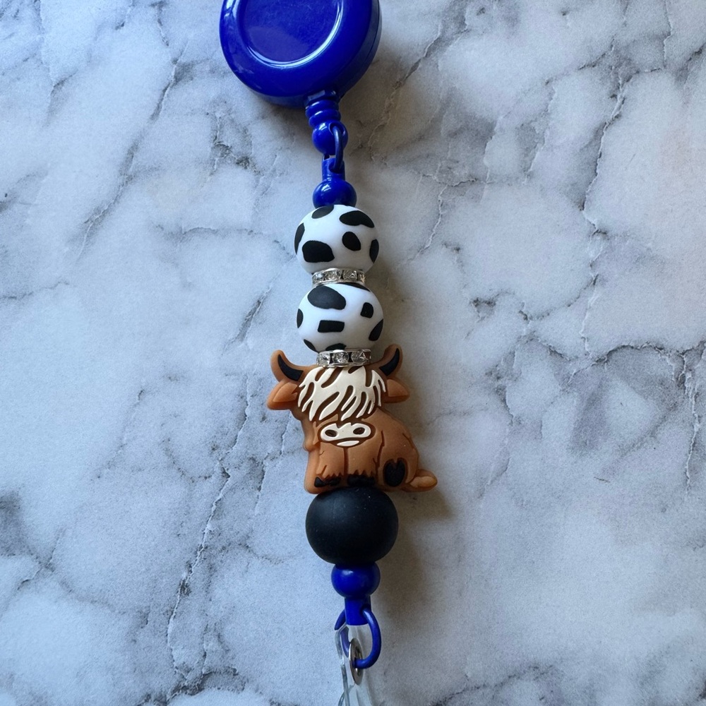 Cow Print Badge Reel with highland cow